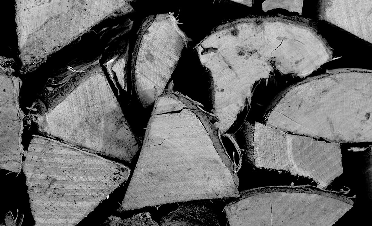 A black and white image of some kiln dried log ends