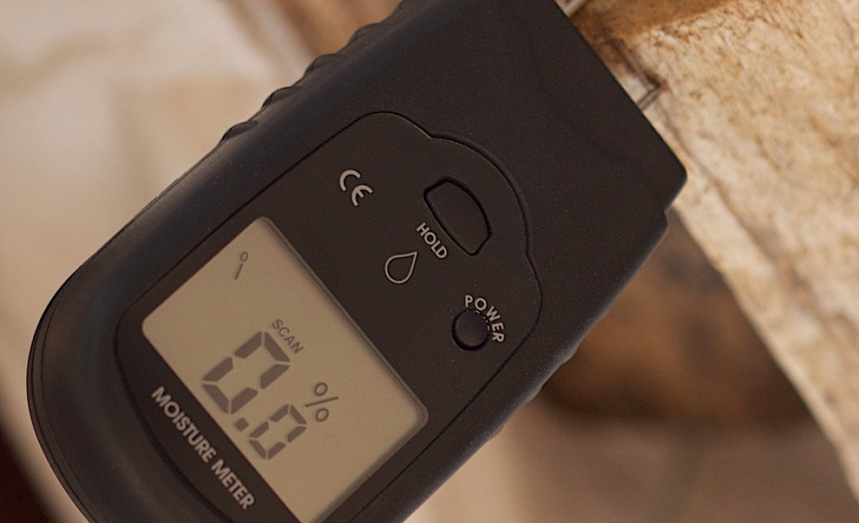 An image of a moisture meter in a kiln dried log