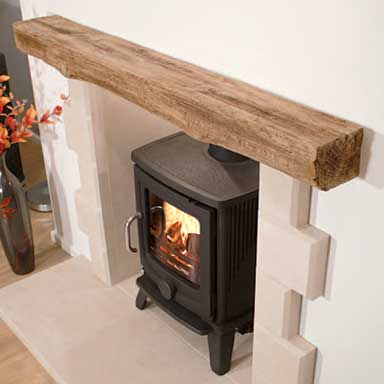 A timber-effect beam with a wood burning stove